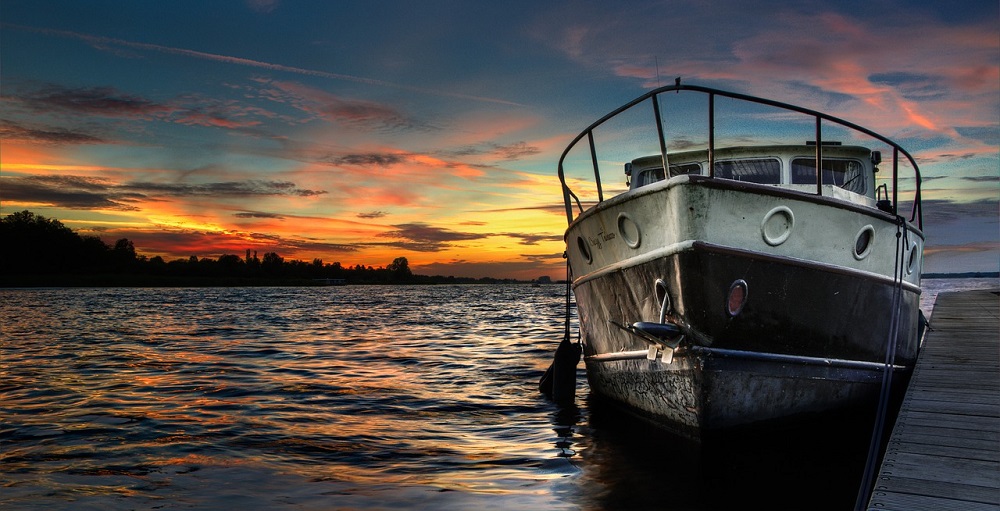 Boat docked at sunset