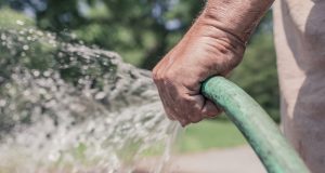 Man holding hose